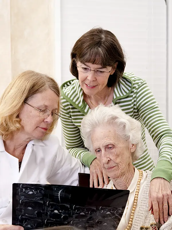 elderly woman consulting doctor about personal care